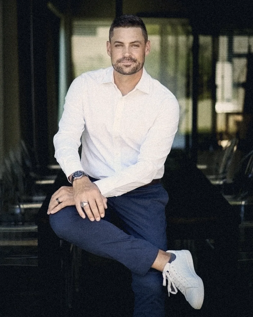 Erik Kruger seated, relaxed, in a boardroom
