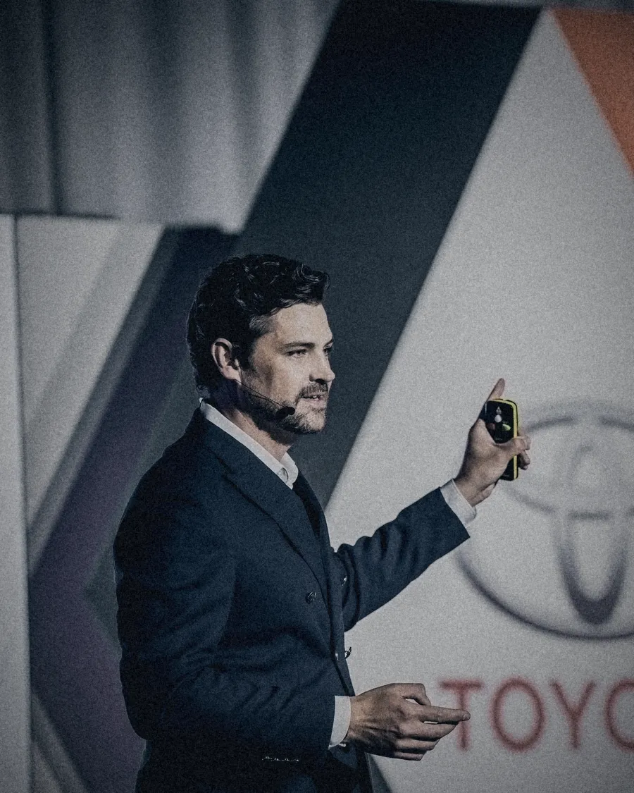 Erik Kruger presenting a keynote with a clicker in hand