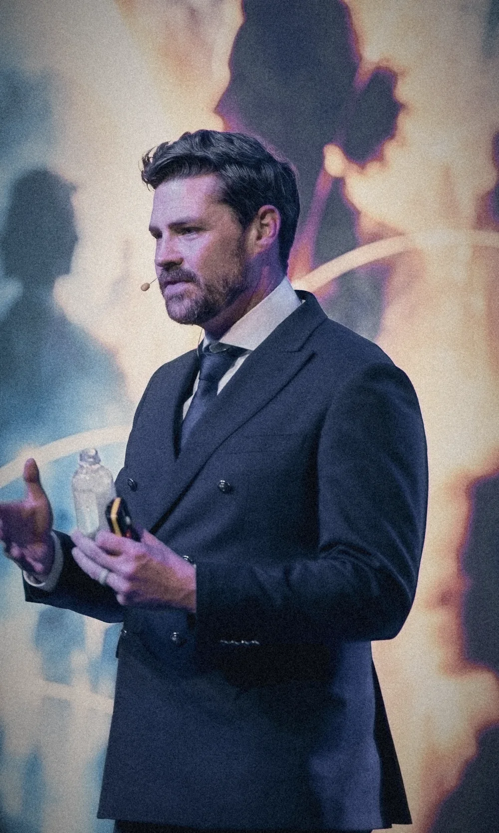 Erik Kruger speaking on stage, close up