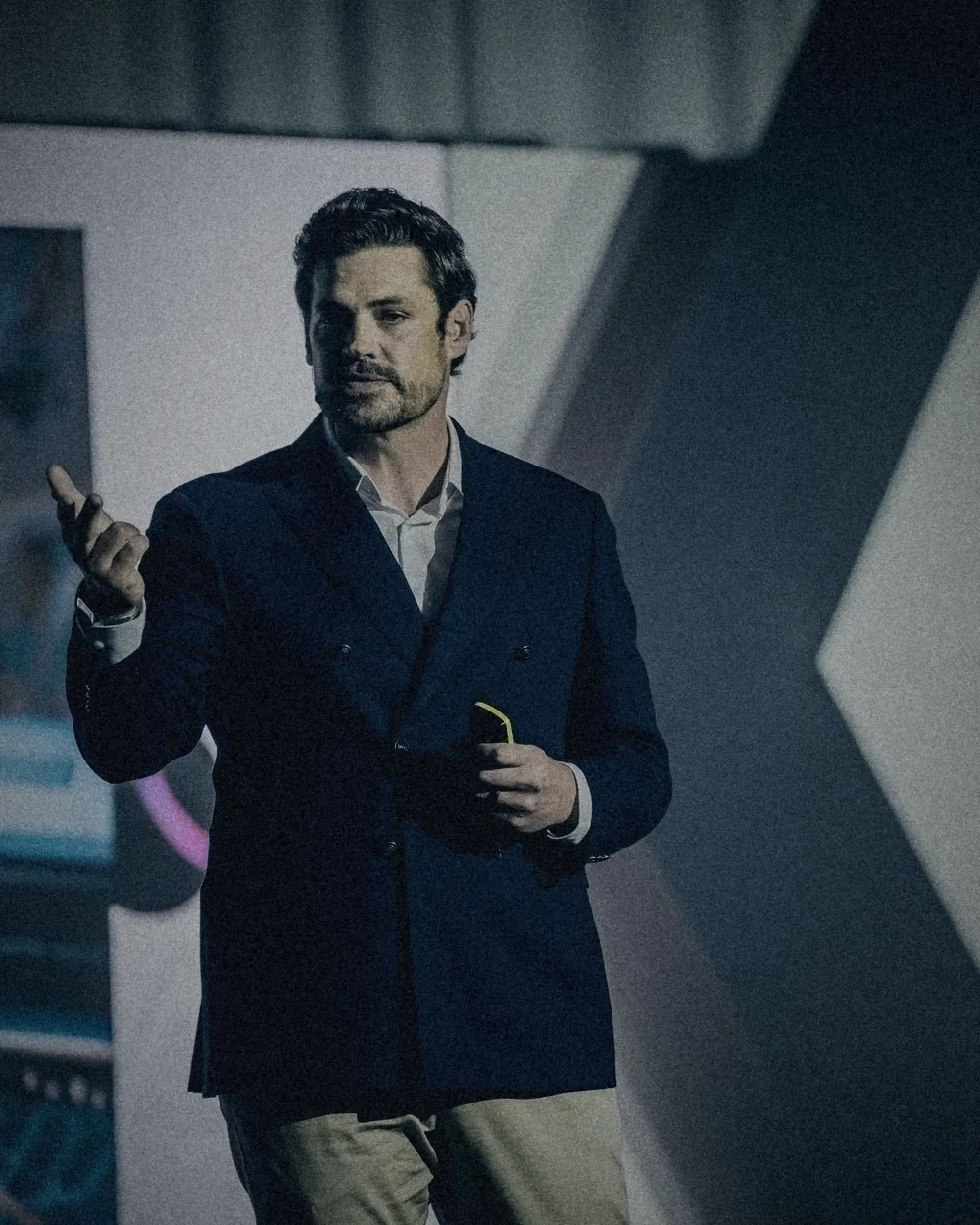Erik Kruger gesturing while delivering a conference keynote